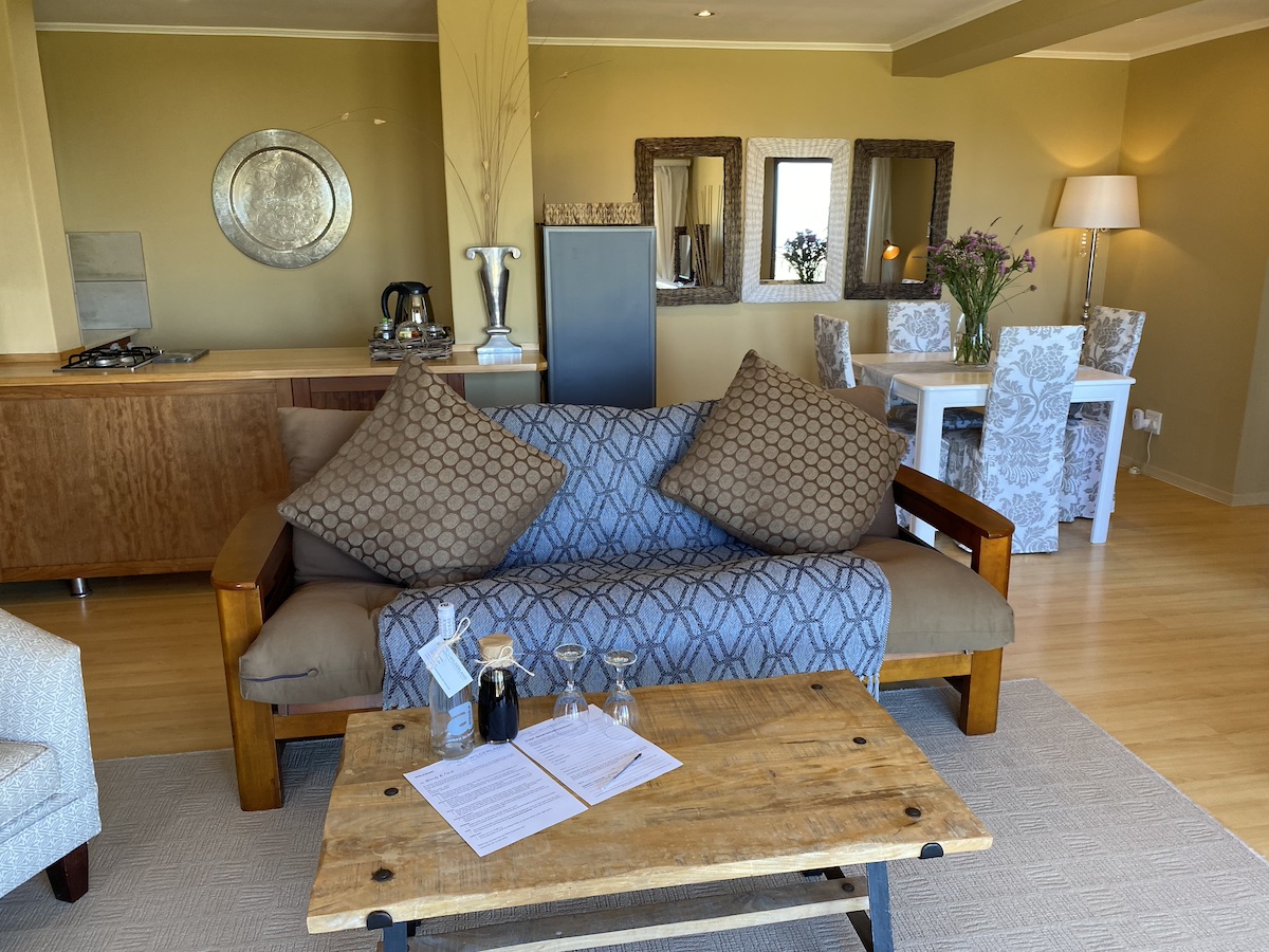 Blue patterned sofa and timber coffee table in the lounge